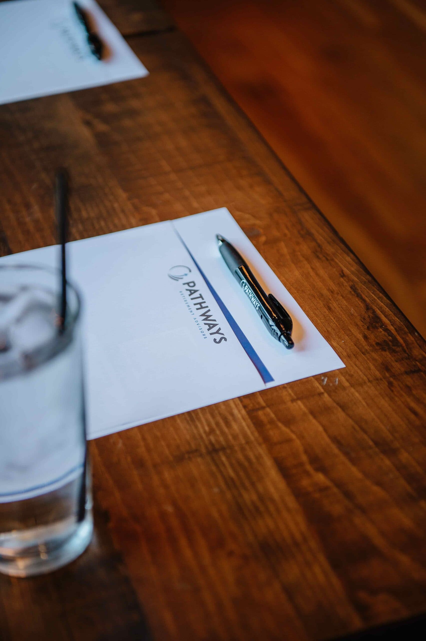 A Pathways Retirement Advisors folder on a table